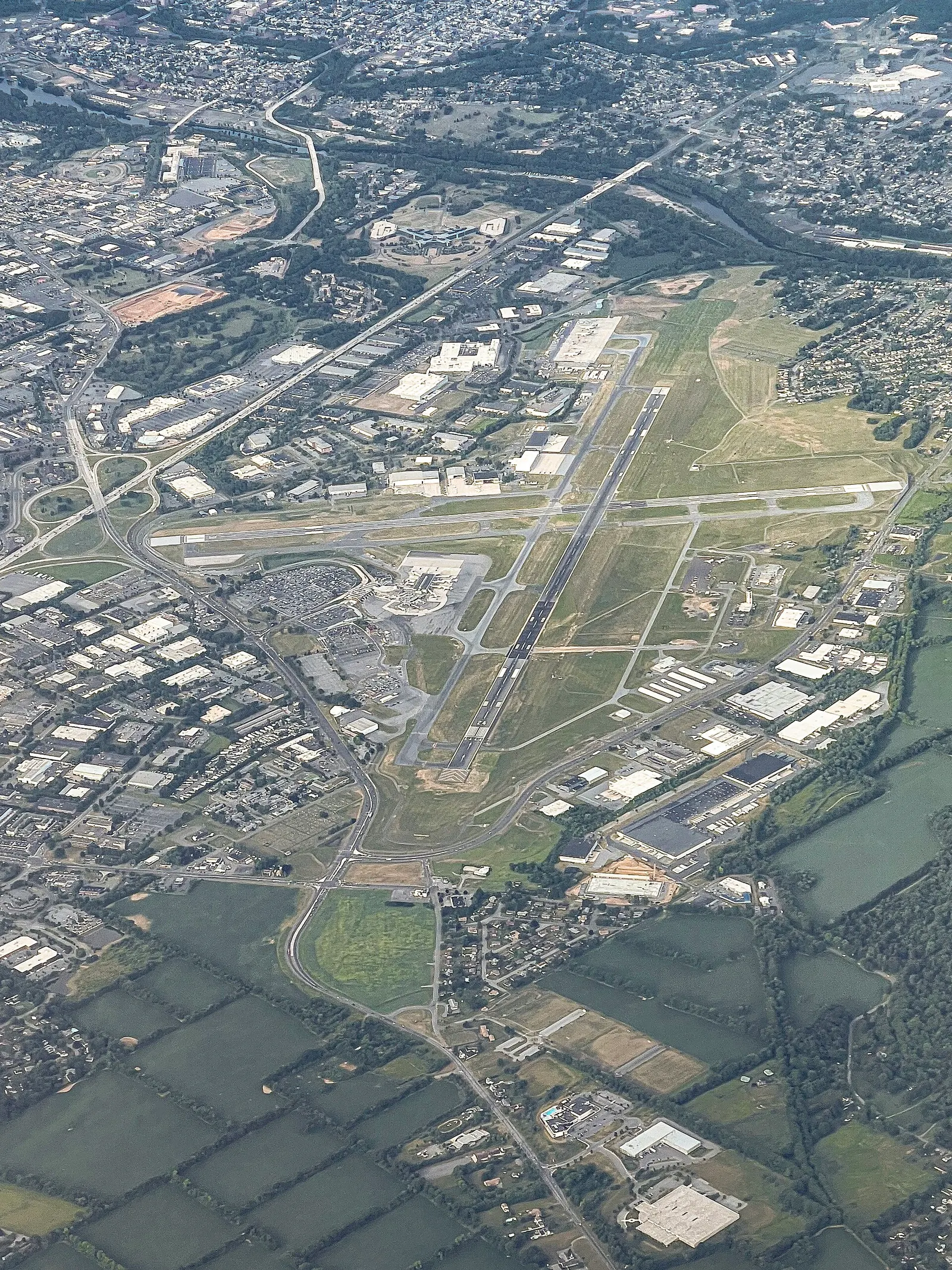 Aerial view of Lehigh Valley International Airport looking across the civil terminal, apron, and intersecting runways in Hanover Township.