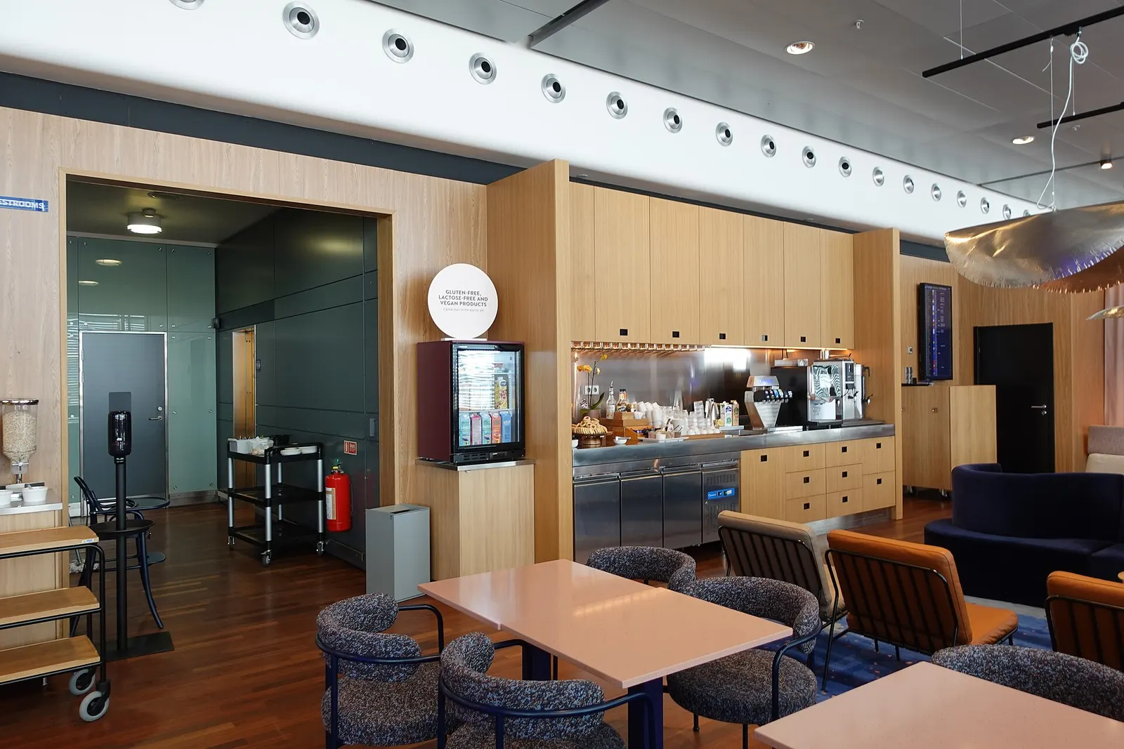 The gold-section interior of the SAS Lounge by Mastercard at Arlanda.