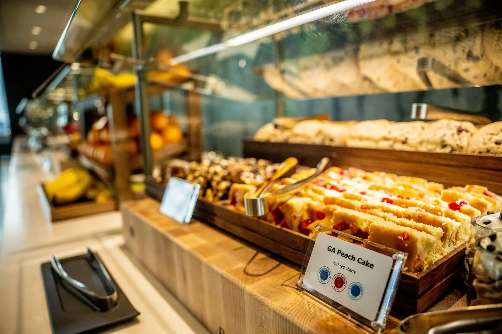 Food buffet and beverage-station area inside the Delta Sky Club in ATL Concourse D.