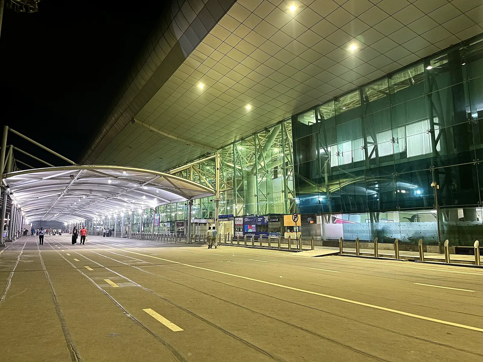 Night curb and glass facade of the integrated passenger terminal at Sri Guru Ram Dass Jee International Airport, Amritsar, 2024