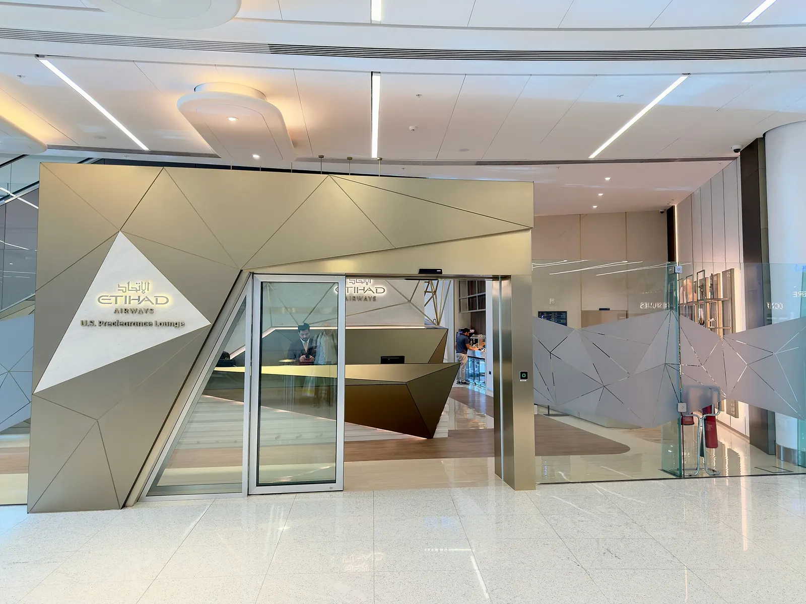 Interior view of the U.S. Preclearance Lounge at Zayed International Airport.