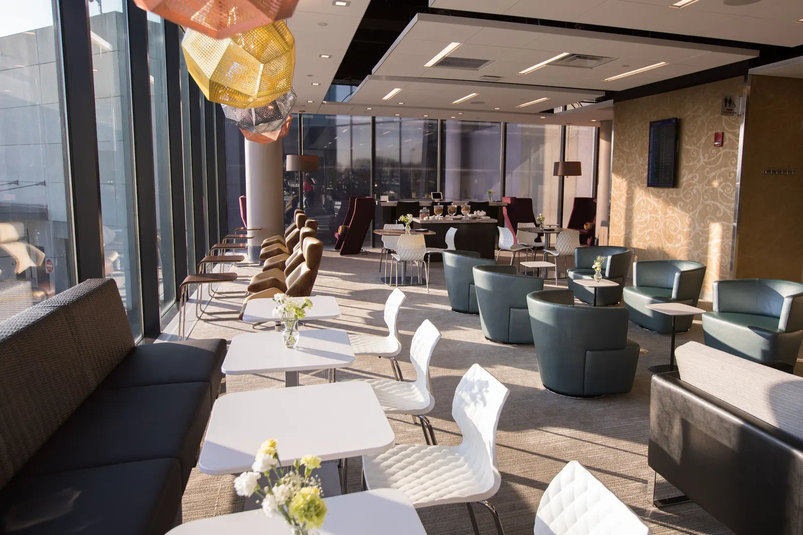 Lounge overview with sofas and tarmac views in the Escape Lounge at Bradley International Airport (BDL).