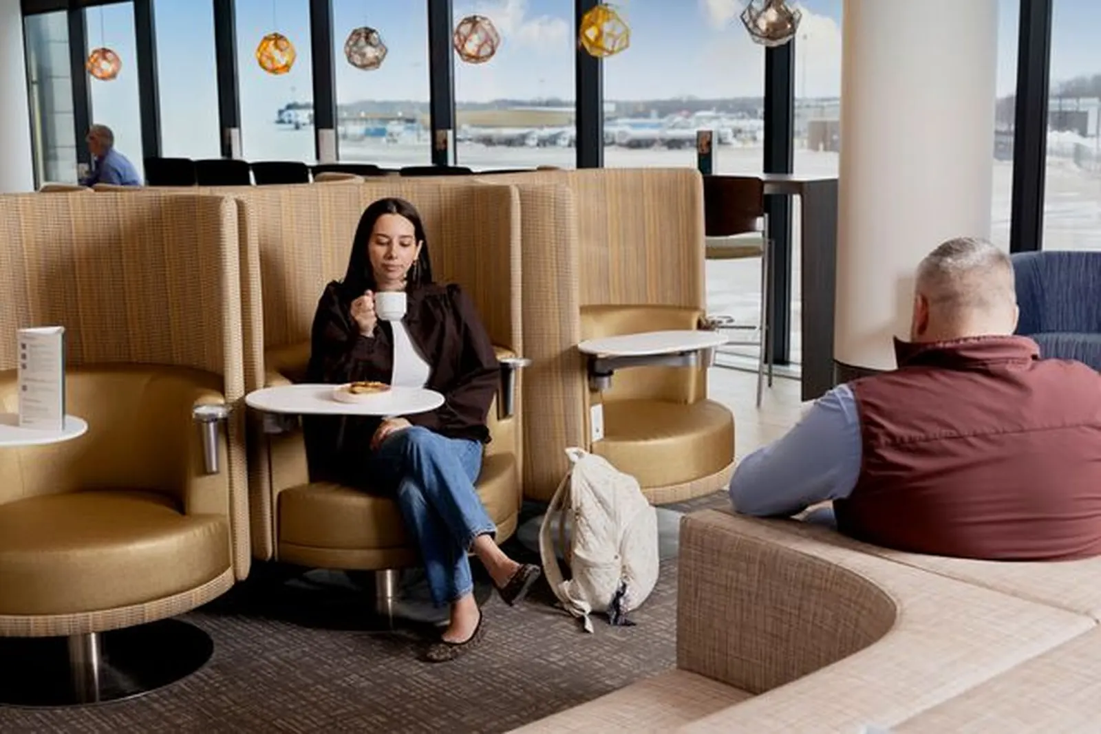Wingback seating nooks in the Escape Lounge at Bradley International Airport (BDL).