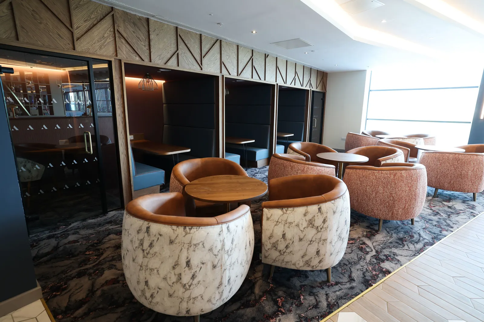 Tub-chair lounge seating in the Aspire Lounge at George Best Belfast City Airport (BHD).