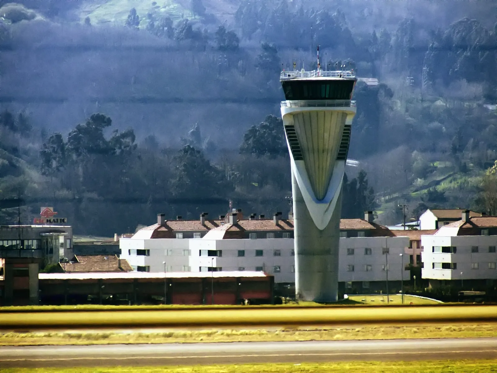 The following is the author's description of the photograph quoted directly from the photograph's Flickr page. "Taken from the departures corridor, from the interior of the terminal. "