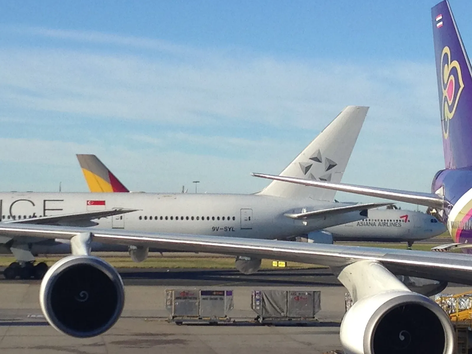 It was just pushing back for the late morning departure to SIN as the Asian 330 taxied by. The Thai 747-400 remains on stand for a lost of the day before departing to BKK. Taken from the Sydney Airport Emirates Lounge.