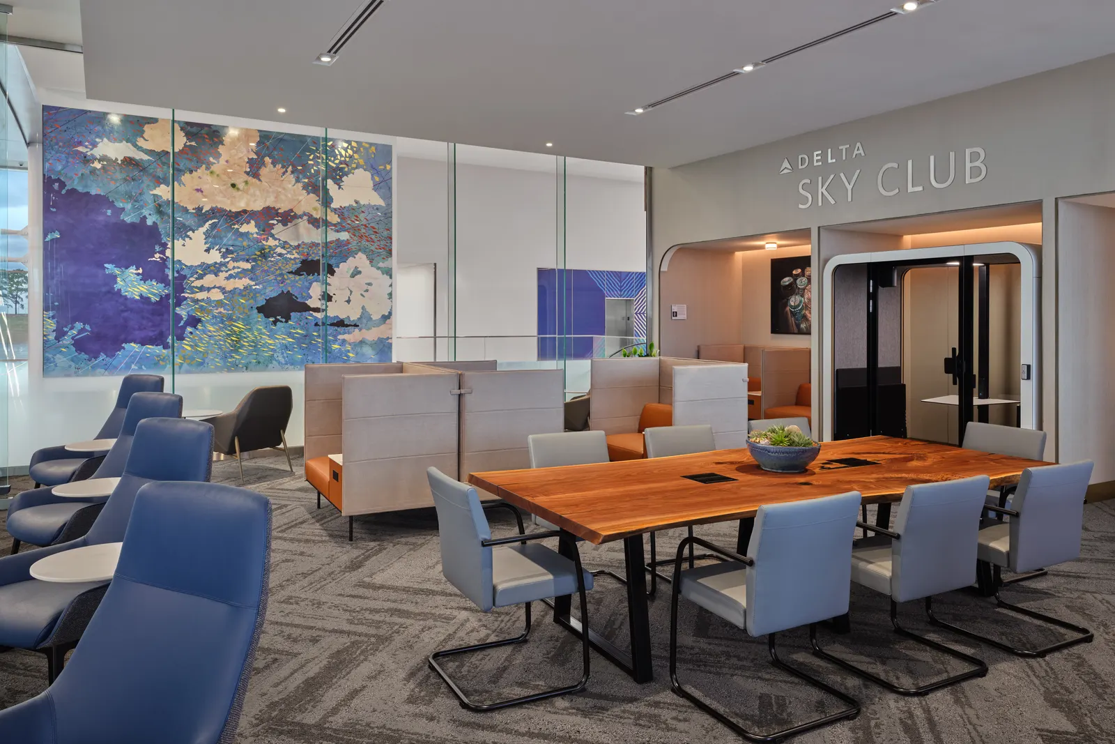Soundproof work booths in the Delta Sky Club at Charlotte Douglas Concourse A (CLT).