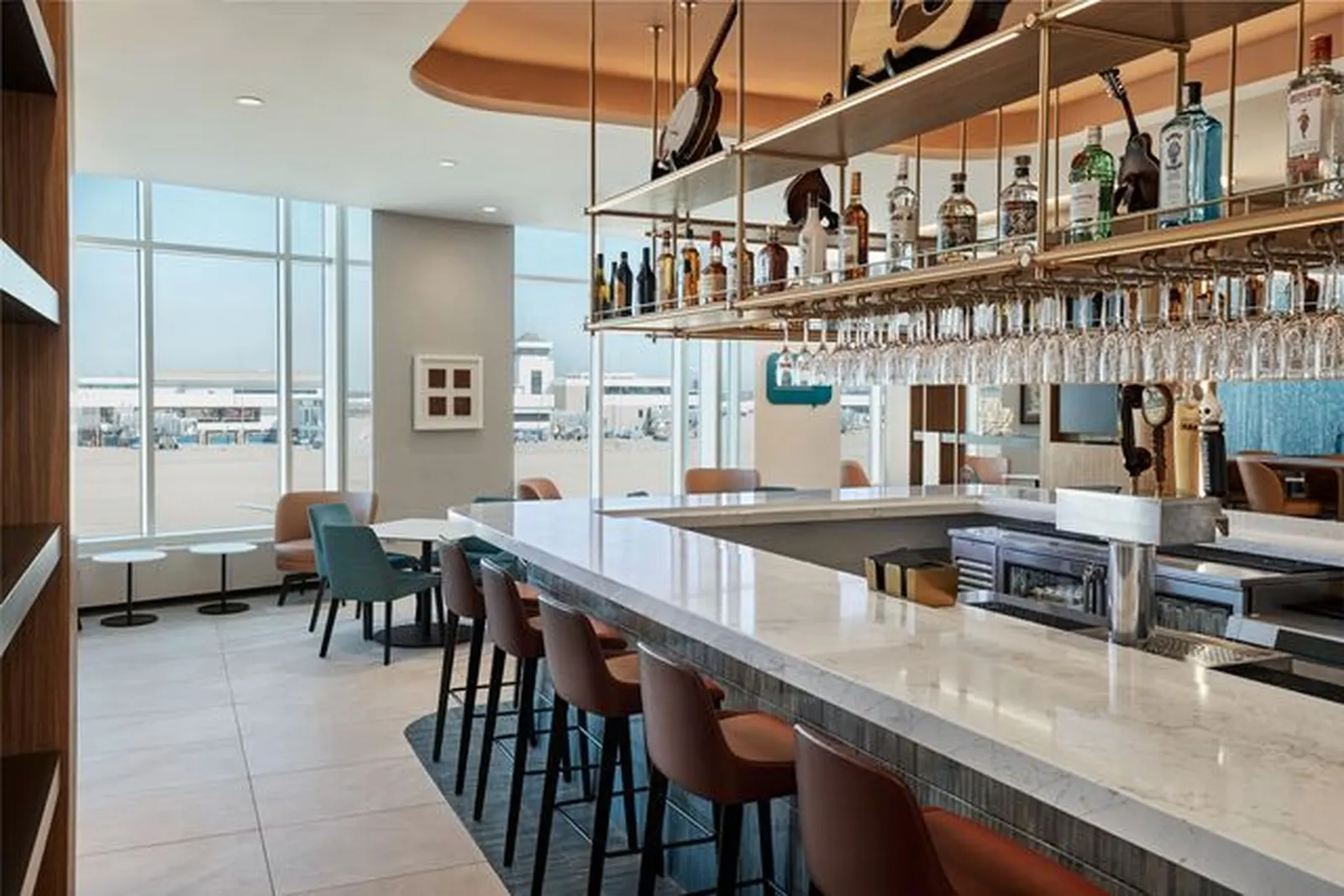 Bar and bar seating in the Escape Lounge at Cincinnati/Northern Kentucky International Airport (CVG).