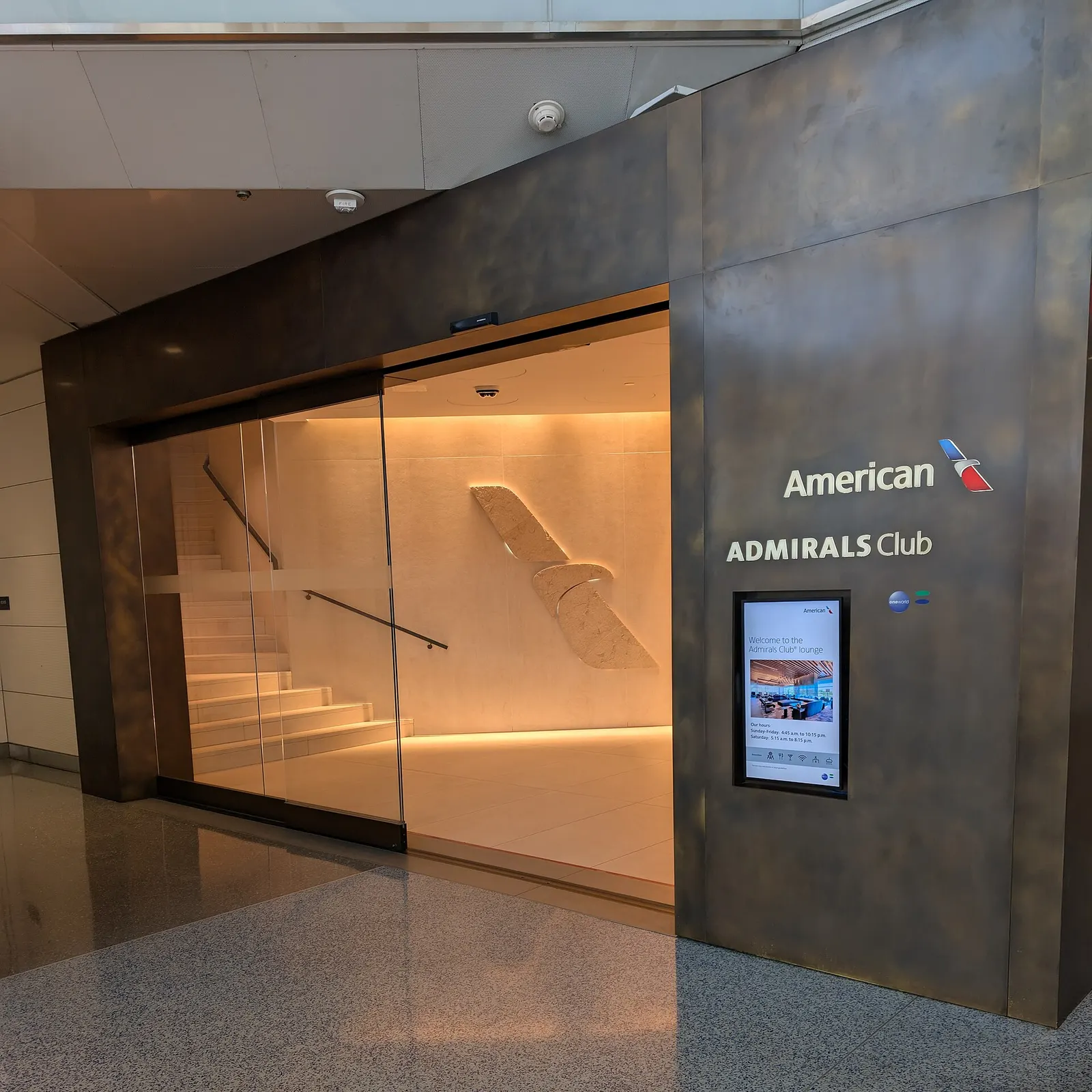 The entrance to the American Airlines Admirals Club at Concourse E. The club is up one level and the stairs are just inside the entrance on the left. Terminal 2, Washington National Airport, Arlington, Virginia 22201.