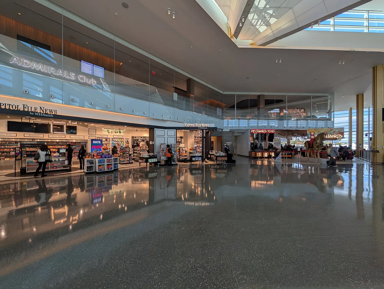 The start of the "E" Concourse (closest to the terminal). Capitol File News and P.F. Changs are on the ground floor and above them are an American Airlines Admirals Club. Terminal 2, Washington National Airport, Arlington, Virginia 22201.