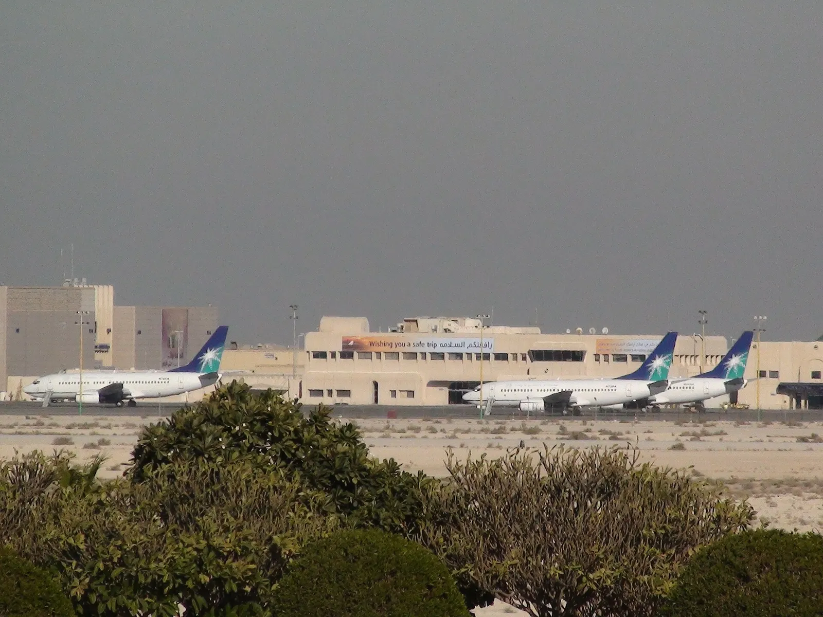 Saudi Aramco airplanes (3 Boeing 737-700 : N745A, N737A, N743A) parked in the general aviation terminal in King Fahd Interantional Airport in Dammam, Saudi Arabia.