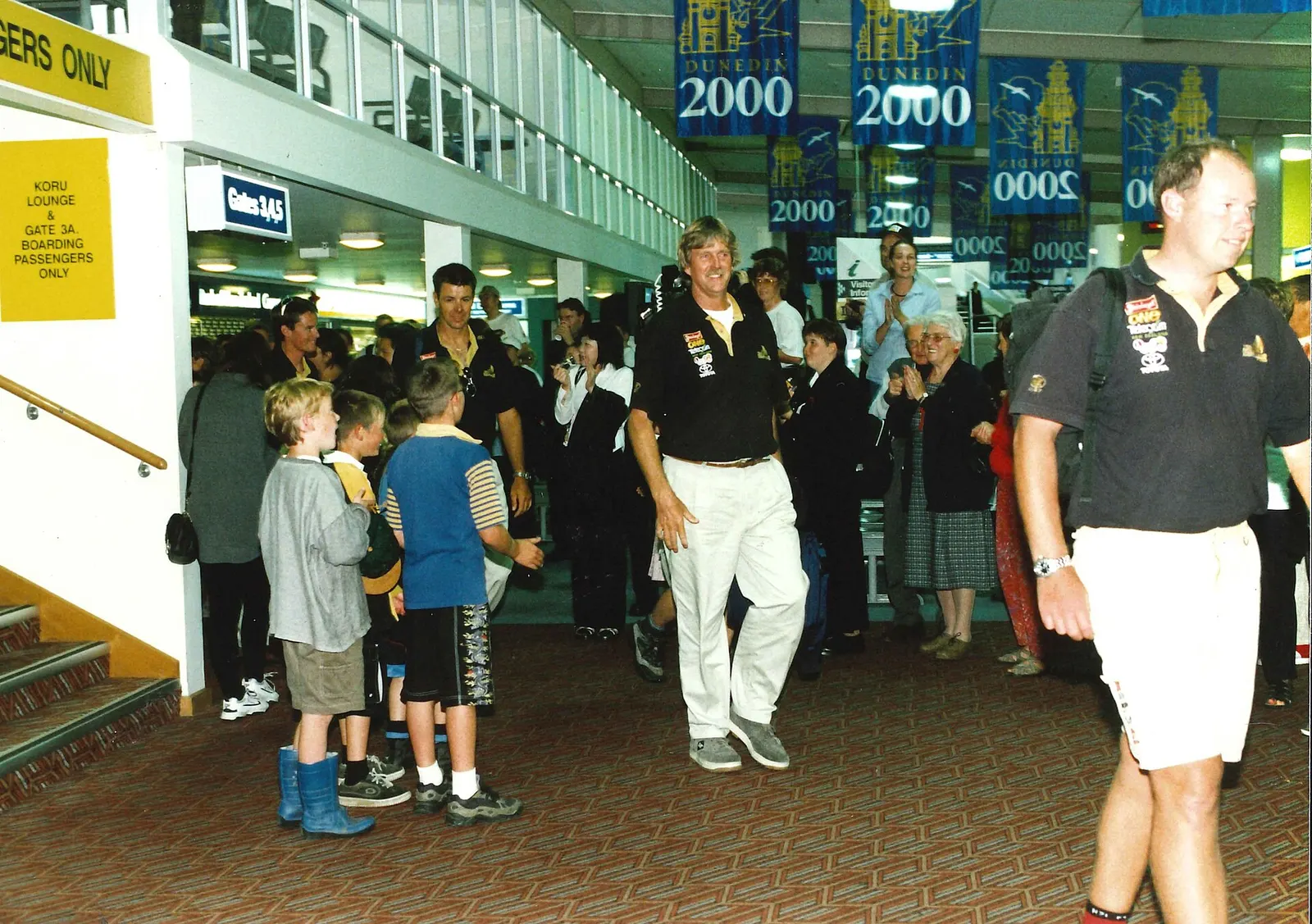 Team New Zealand arriving at Dunedin Airport for the America's Cup Parade 2000