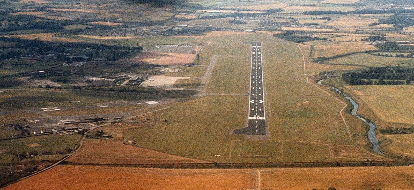 This was the view when on the approach to runway 26 at Edinburgh Scotland. (A little high at that point due to ATC restrictions) Due to the movement of the Magnetic North Pole it's now runway 25. In the intervening years the terminal has been extended and additional taxiways constructed. The "old" o