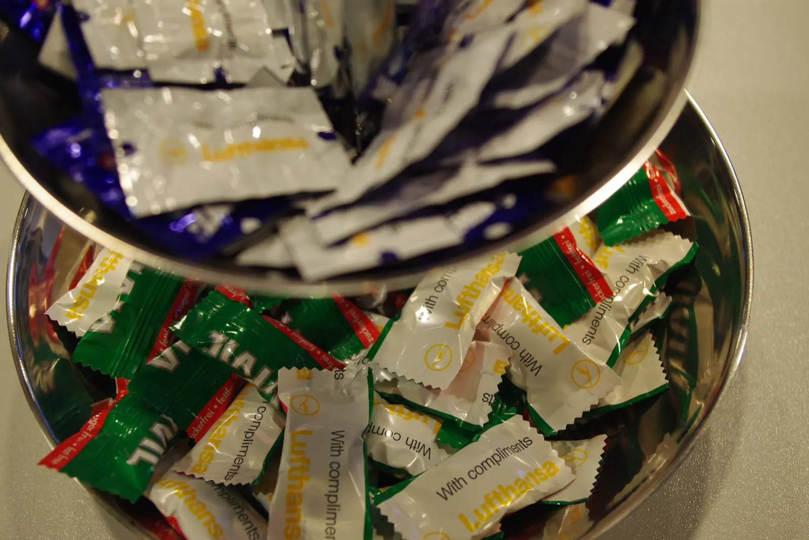 Candy jars and snack bowls on a counter inside the Lufthansa Business Lounge at Frankfurt Airport (FRA).
