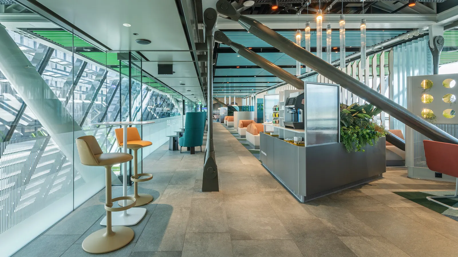 Bar-height seating in the Crystal Lounge by Aspire at Geneva Airport (GVA).