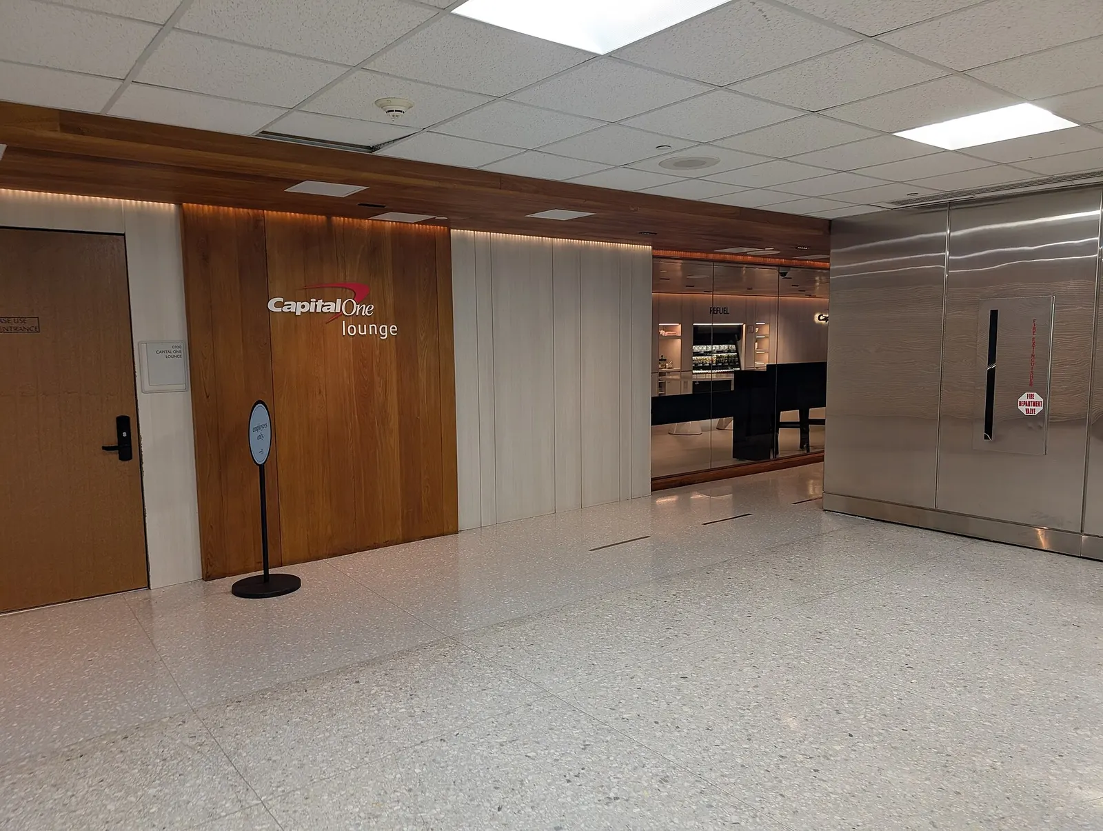 The entrance to the Capital One Lounge just behind security at Dulles Airport. Main Terminal, Dulles Airport, 1 Saarinen Circle, Dulles, Virginia 20166.