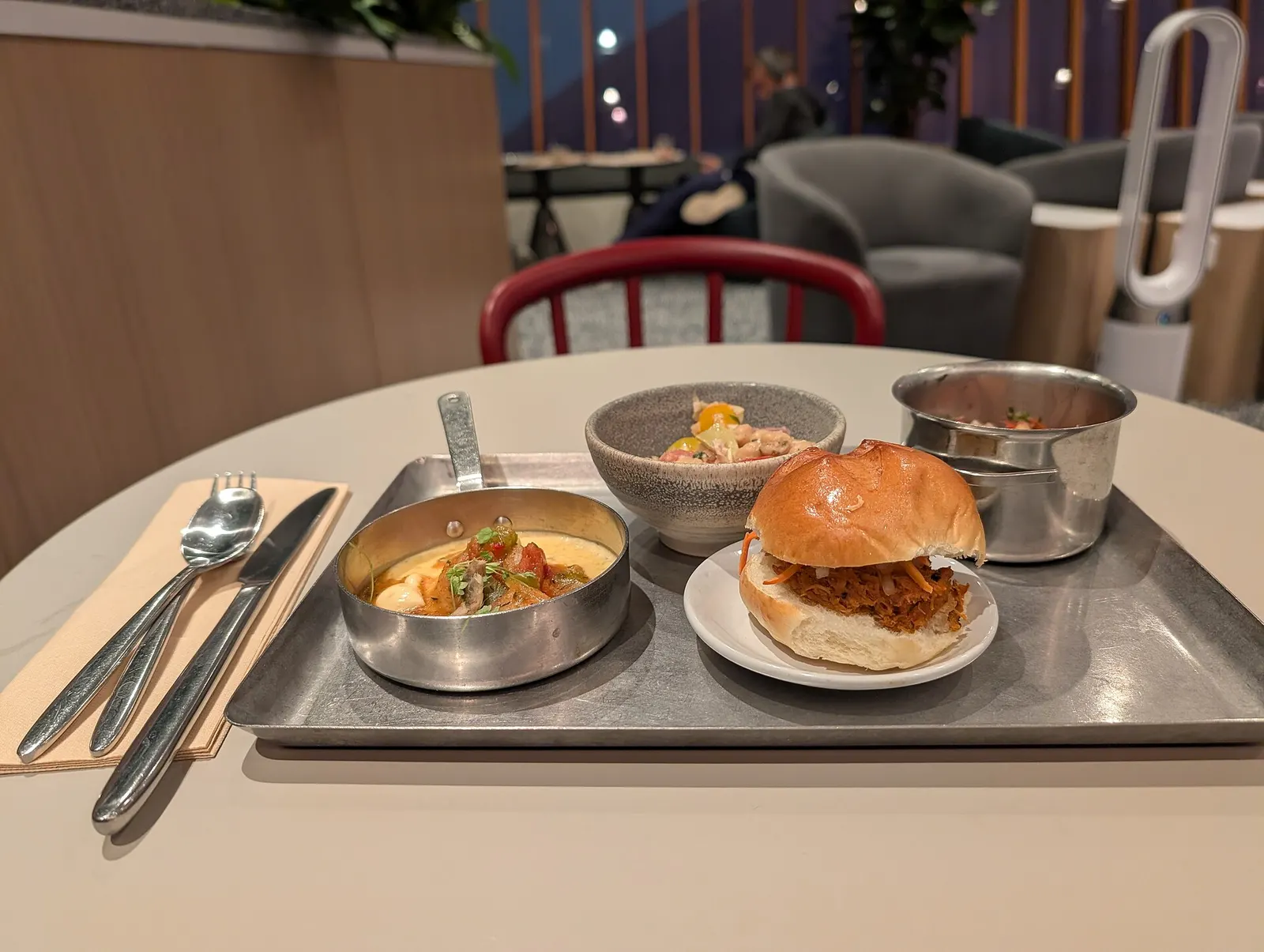 A selection of plated food from the Capital One Lounge inside Dulles Airport. Main Terminal, Dulles Airport, 1 Saarinen Circle, Dulles, Virginia 20166.