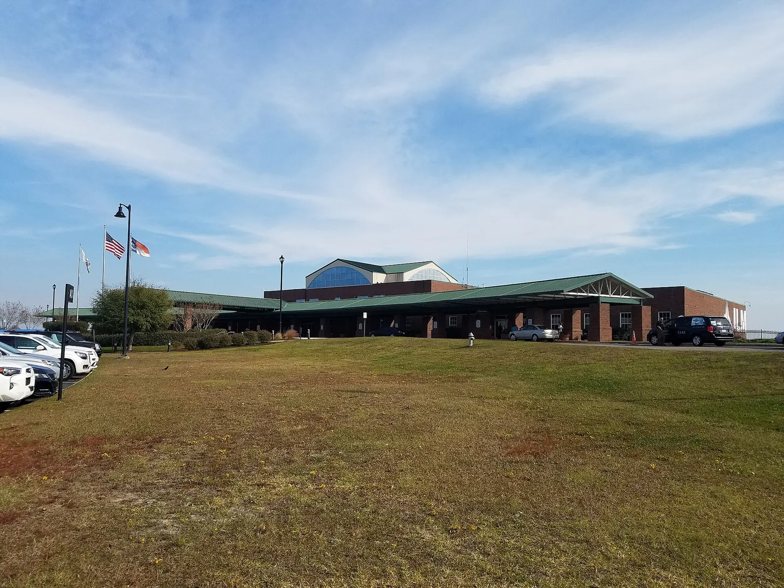 2016 brick-and-canopy exterior of Wilmington International Airport’s main passenger terminal