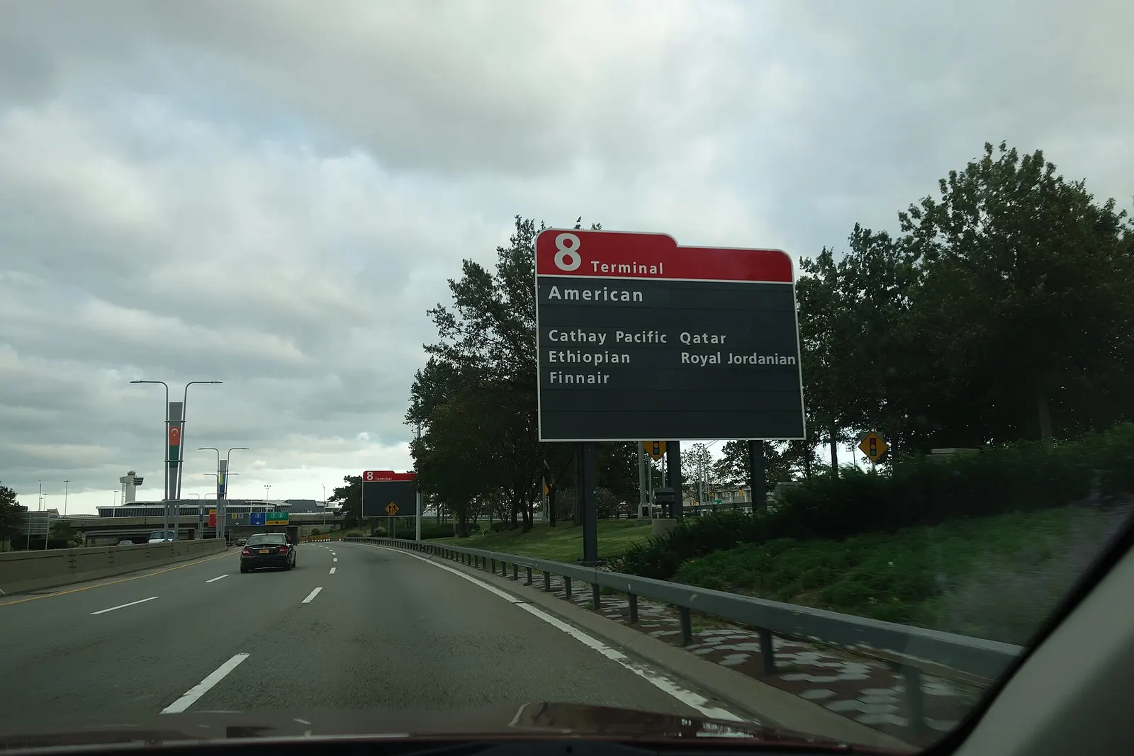 Traveling southeast on the Van Wyck Expressway towards the terminals of John F. Kennedy International Airport, near South Ozone Park, Queens.