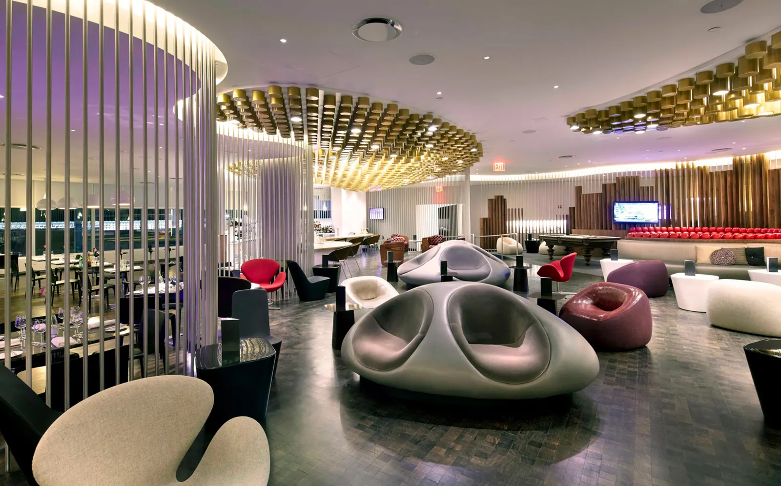 Lounge seating with airfield views in the Virgin Atlantic Clubhouse at New York JFK Terminal 4.
