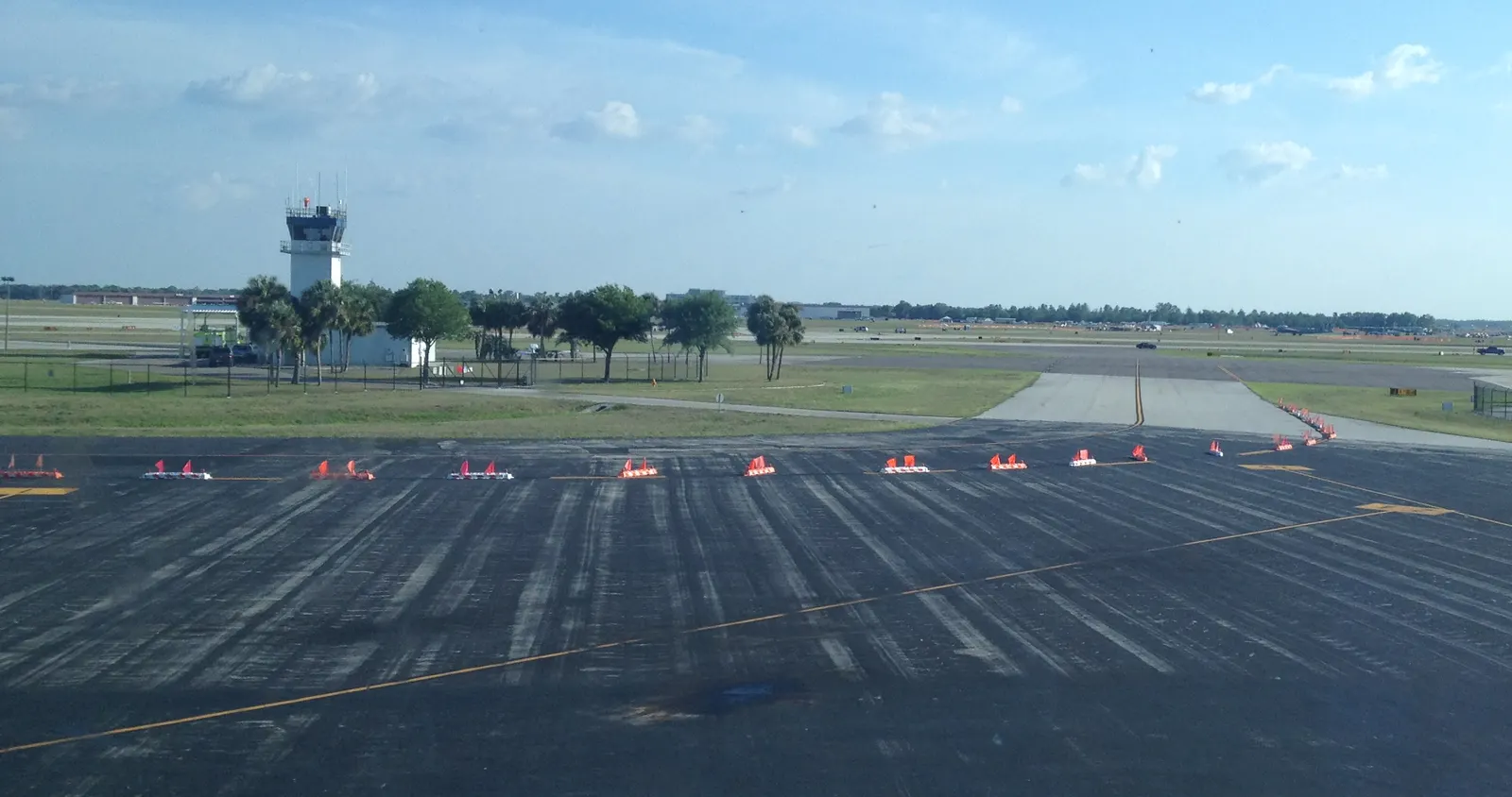 Lakeland Linder air-traffic control tower and airfield ramps seen from the terminal side.