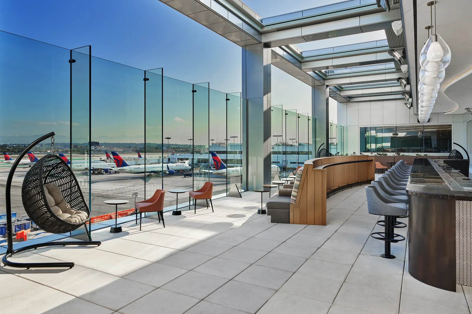 Outdoor Sky Deck terrace seating in the Delta Sky Club at LAX Terminal 3.