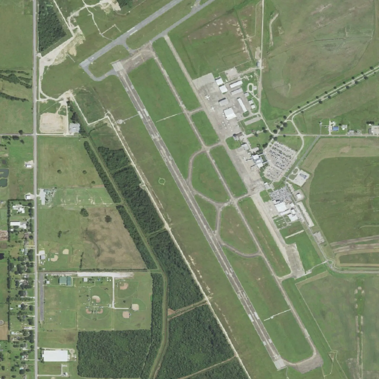 Aerial looking along Lake Charles Regional’s 6,500-foot runway 15/33 with the terminal and parking to the east.