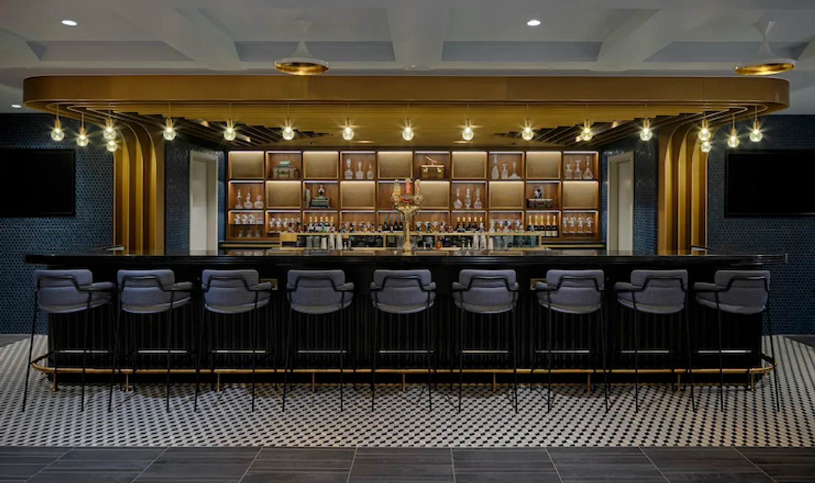 Bar with stools and counter in the Centurion Lounge at London Heathrow Terminal 3 (LHR).