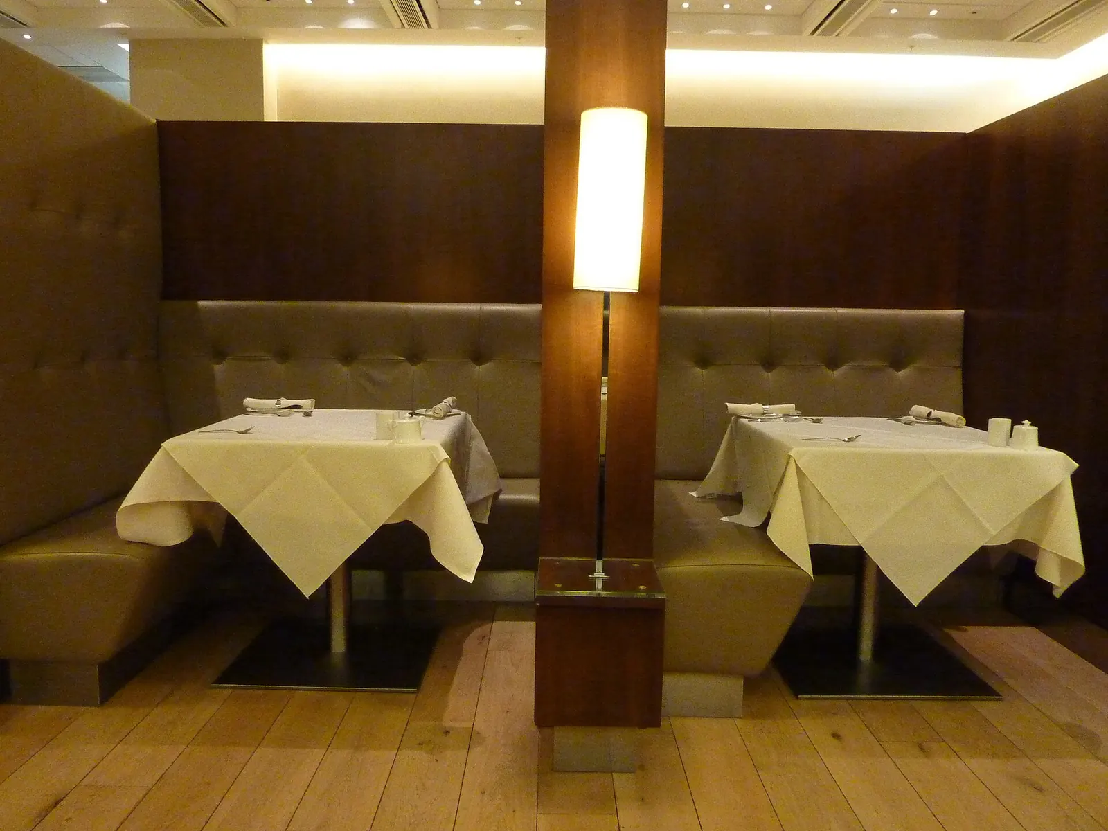 Lounge seating and windows inside the British Airways Concorde Room at Heathrow Terminal 5 (LHR).
