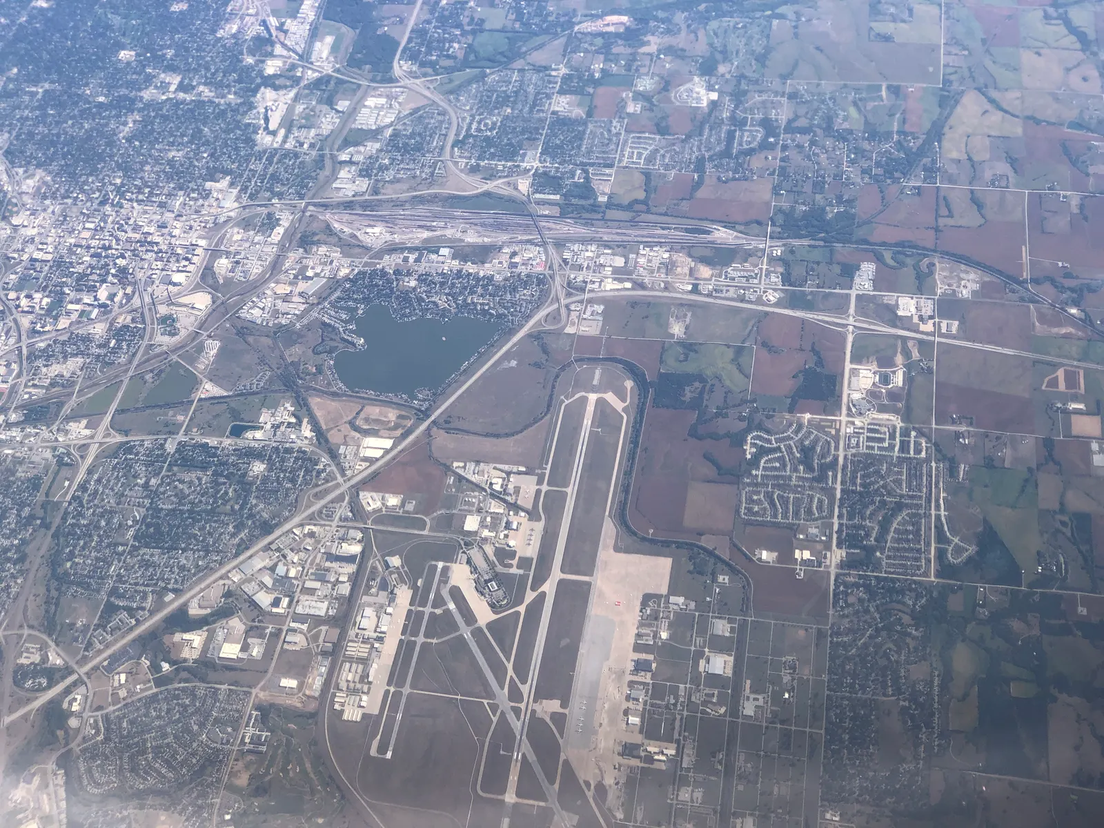 Aerial view of Lincoln Airport looking across the commercial ramp and runways on 11 September 2022