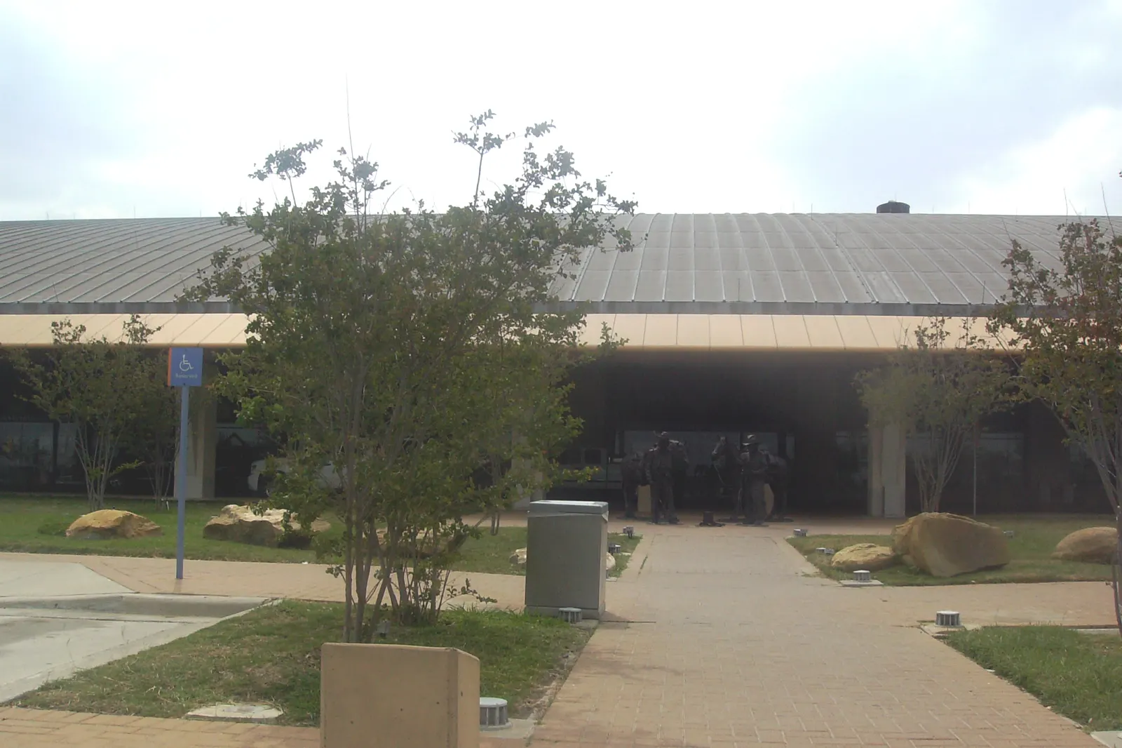 Canopy entrance at Laredo International Airport with the Among Friends There Are No Borders statue, photographed 23 April 2008.