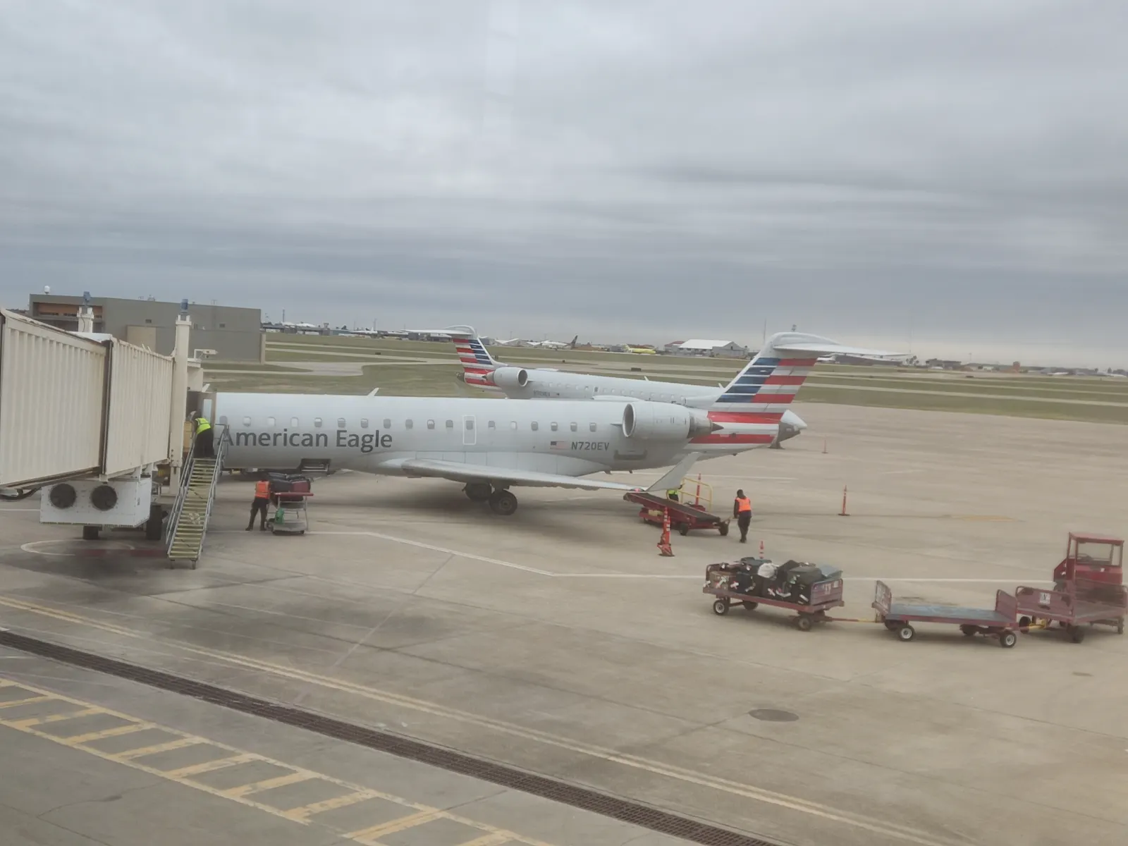 American Eagle CRJ-701ER N720EV on a jet bridge at Laredo International Airport on 18 December 2022.