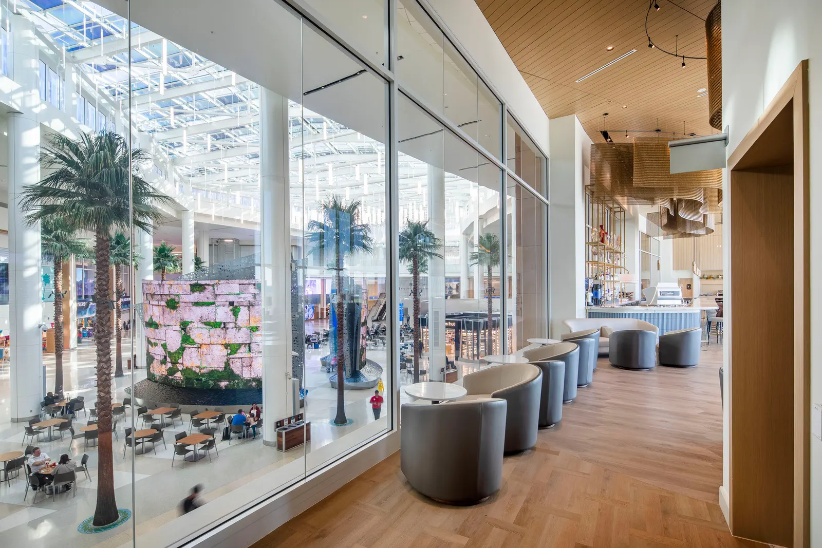 Quiet-zone seating with privacy pods in Plaza Premium Lounge at Orlando Terminal C (MCO).