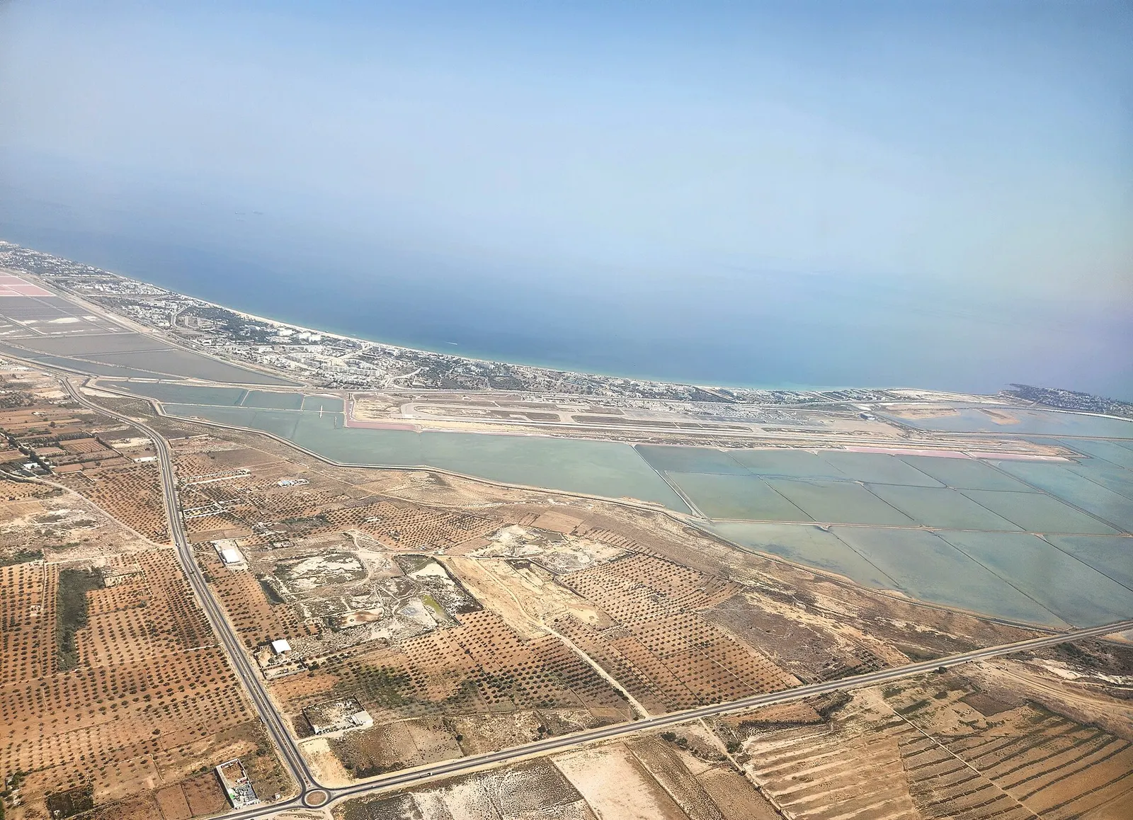 Aerial view of Monastir Habib Bourguiba International Airport and the coast.