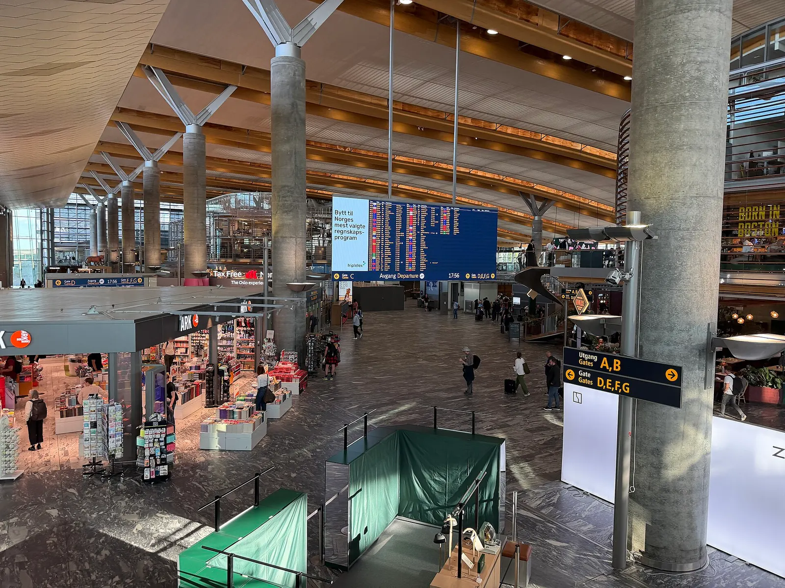 Airside hall at Oslo Airport Gardermoen in 2026 with departure screens and gate signs for A/B and D/E/F/G