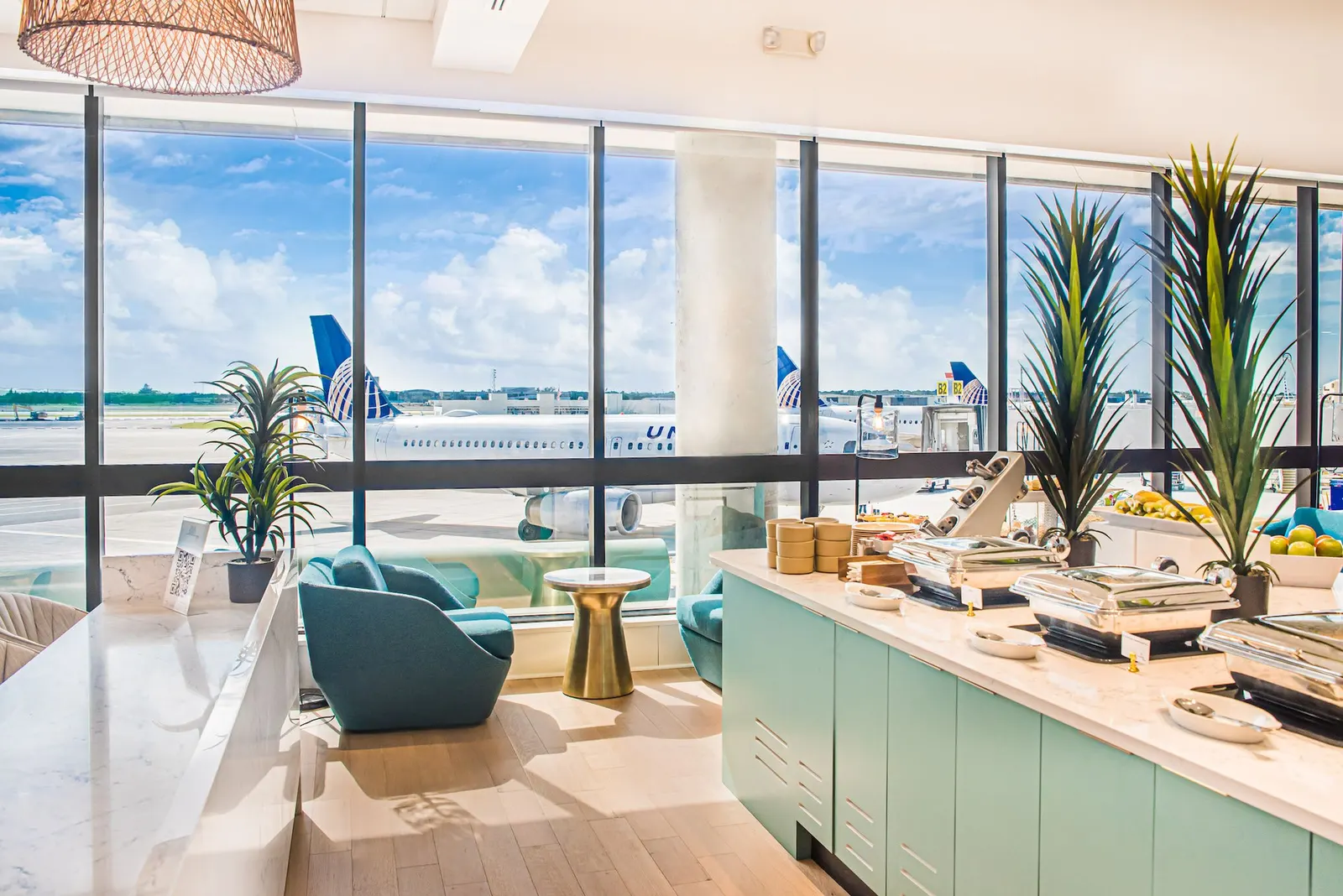 Window seating with tarmac views in the Escape Lounge at Palm Beach International Airport (PBI).