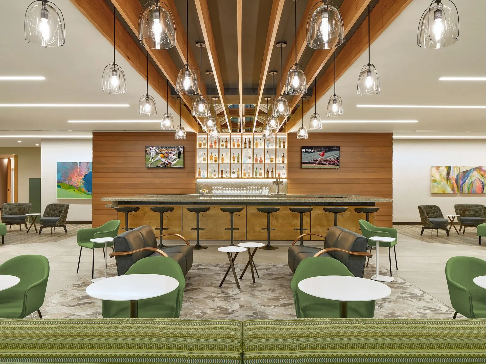 Bar and lounge seating in the Escape Lounge at Portland International Airport (PDX).