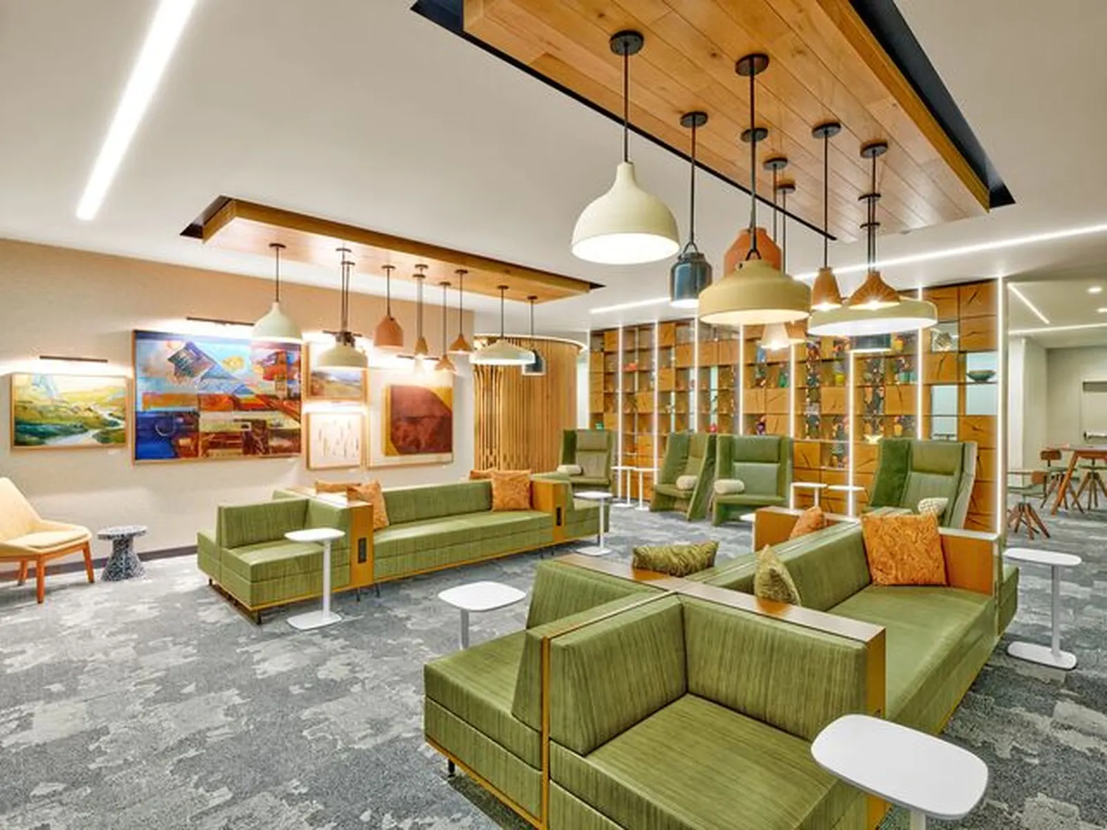 Multi-use lounge seating area in the Escape Lounge at Portland International Airport (PDX).