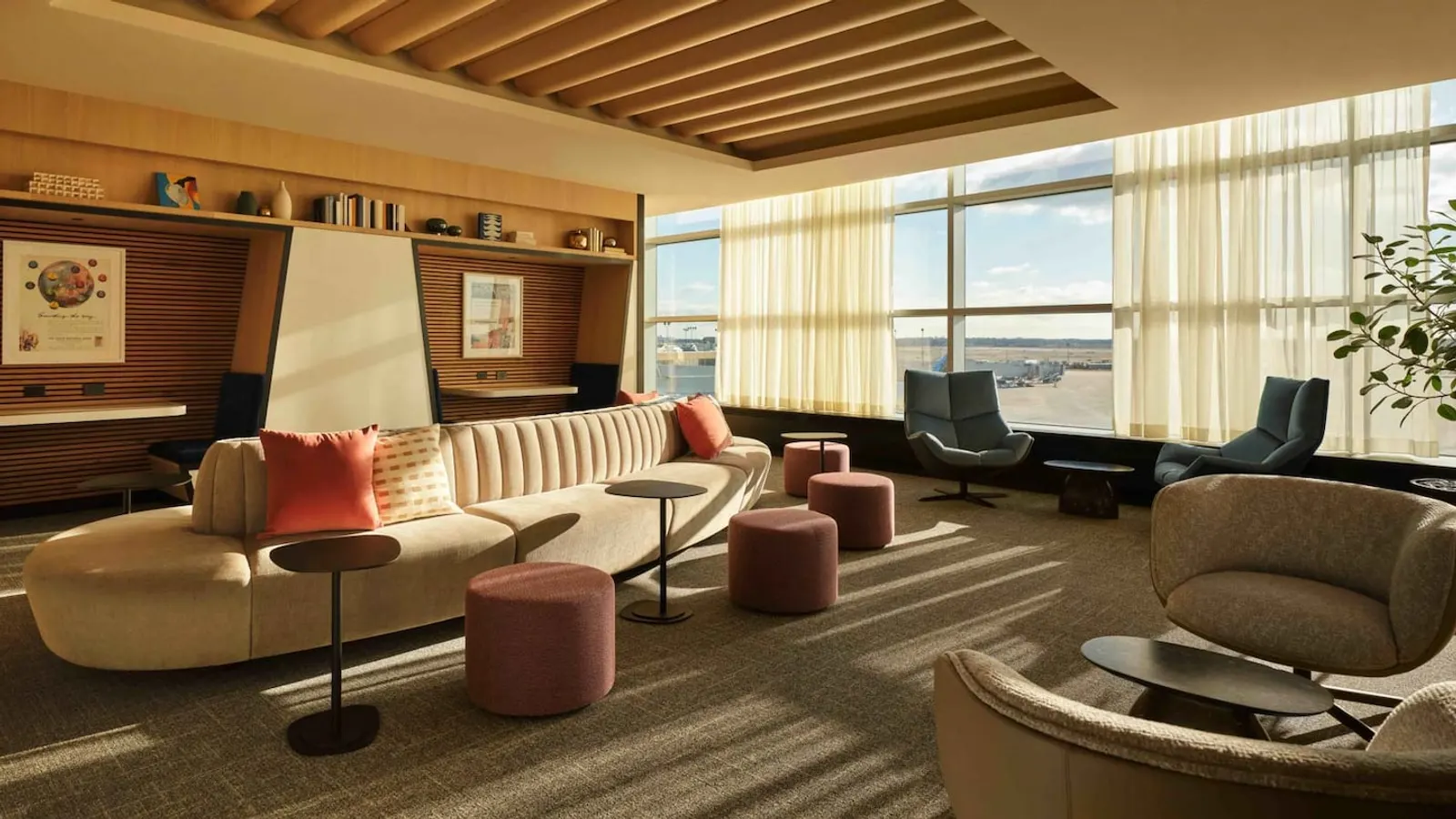 Lounge seating with tarmac views in the Chase Sapphire Lounge by The Club at Philadelphia International Airport (PHL).