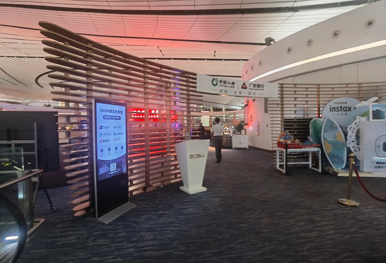Reception desk at the CHUM VIP Lounge in Beijing Daxing International Airport.