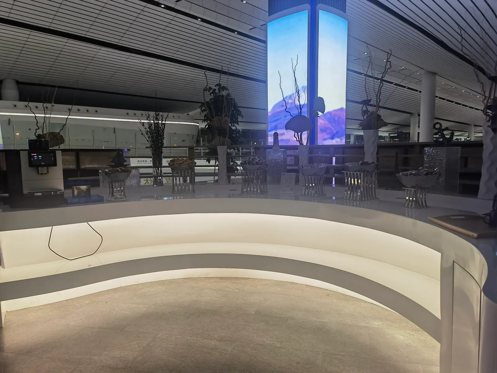 Food service counter inside the CHUM VIP Lounge at Beijing Daxing International Airport.