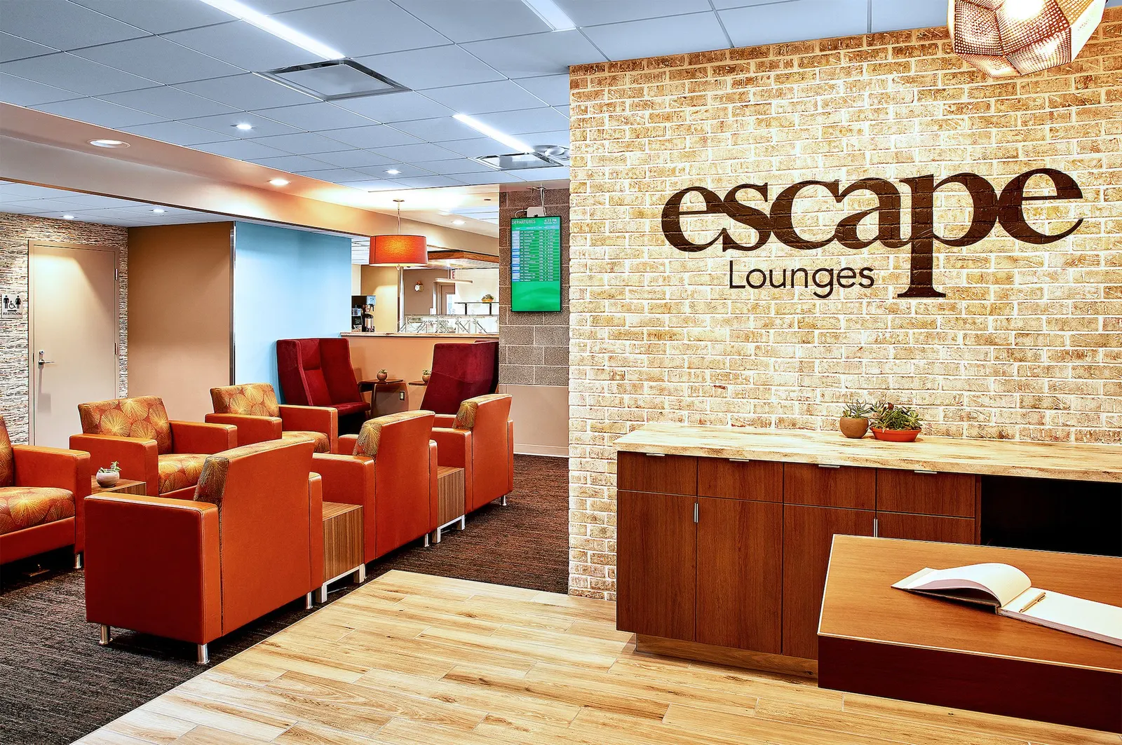 Reception and seating in the Escape Lounge at Rhode Island T.F. Green International Airport (PVD).