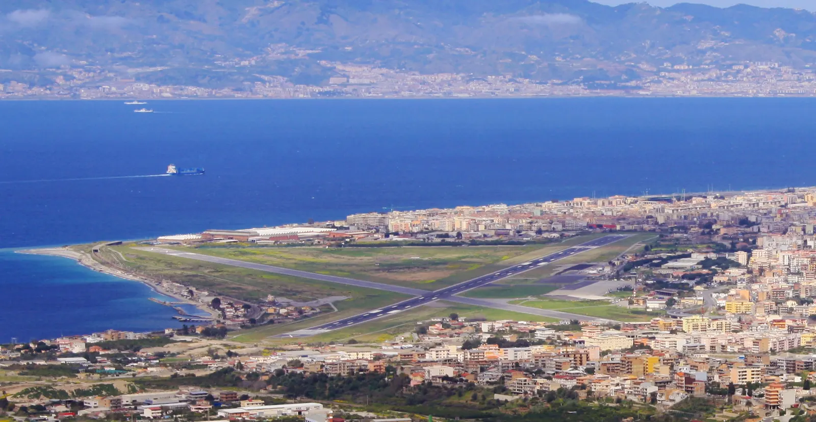 The runway and terminal at Reggio Calabria Airport, seen from the airfield side