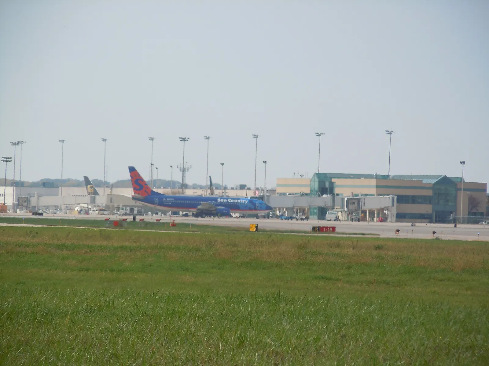 Main Terminal exterior at Chicago Rockford International Airport with a passenger jet at the gate.