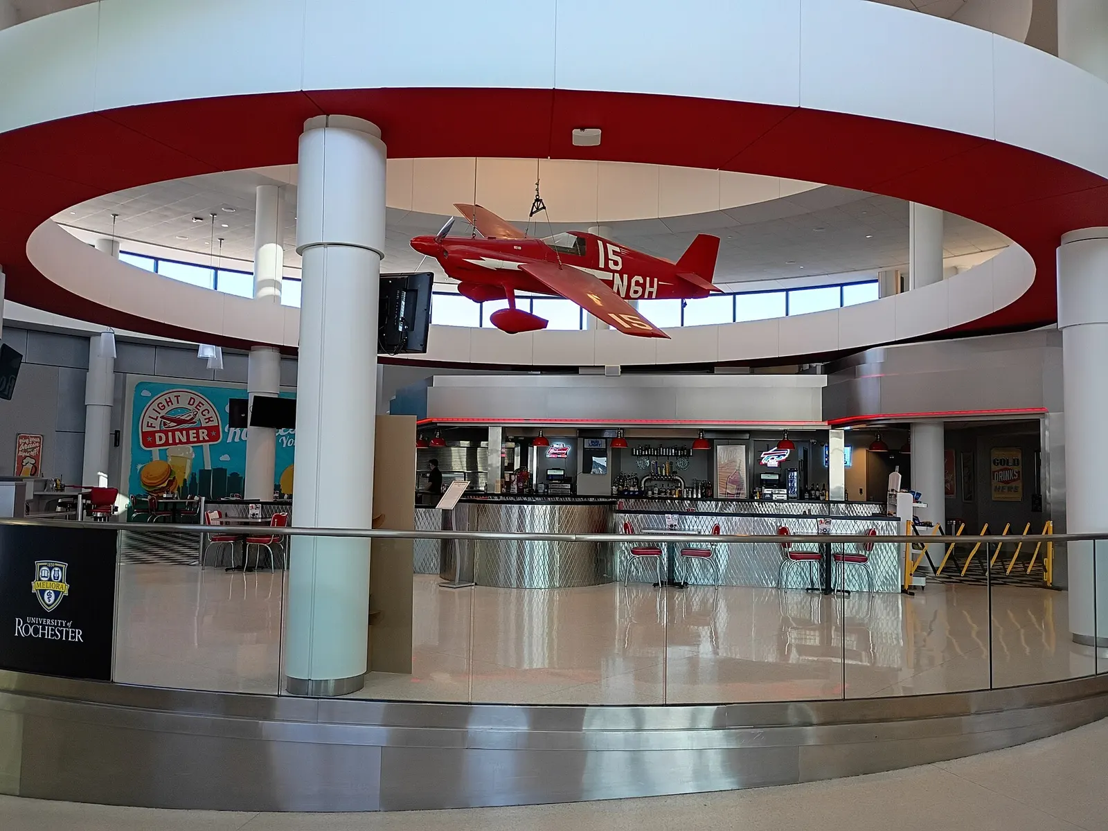 Morning view of the Frederick Douglass Greater Rochester International Airport terminal and garage from the approach road in July 2025.