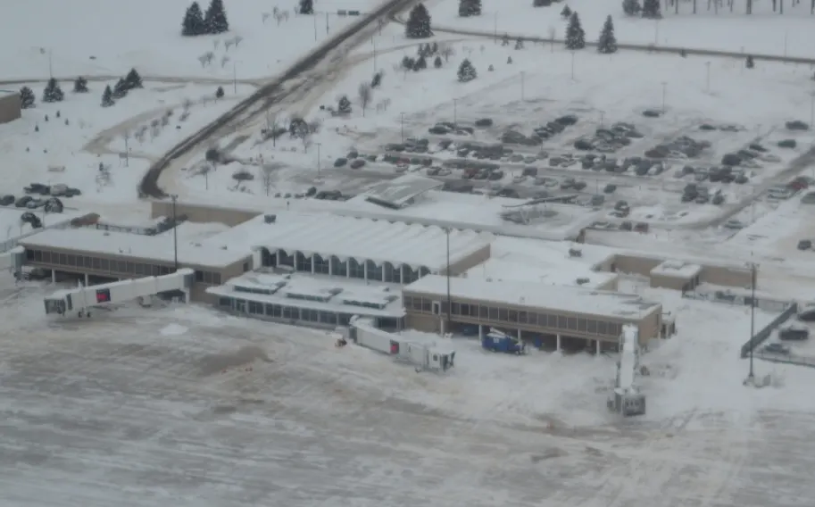 Historic December 2010 aerial of Rochester International Airport (RST) in Rochester, Minnesota, looking across the terminal and airfield.
