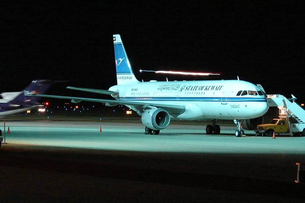 A State of Kuwait Airbus A320 parked at Rochester International Airport, photographed from the parking lot after an American Eagle arrival.