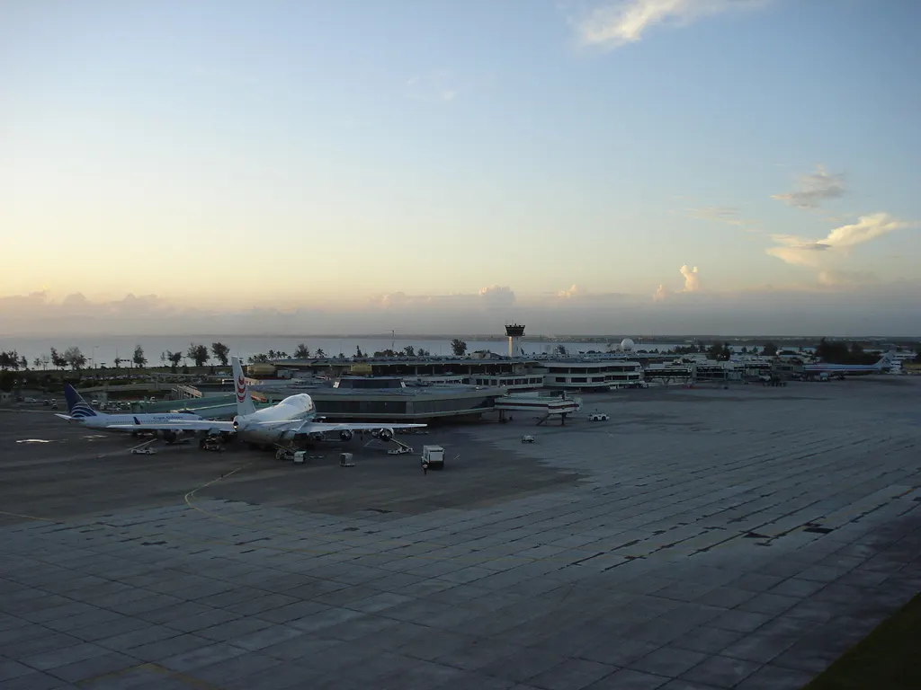 Las Americas Airport. Air Pullmantur operating a charter flight from MAD, with one of the usually 3 flights of Copa Airlines , at Terminal A. In Terminal B, can see one of the 16 flights operating by American Airlines da.