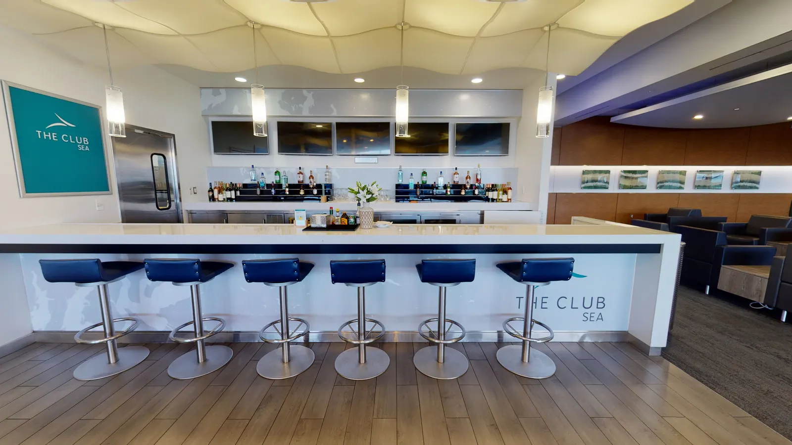 Bar counter and stools in The Club at SEA South Satellite.