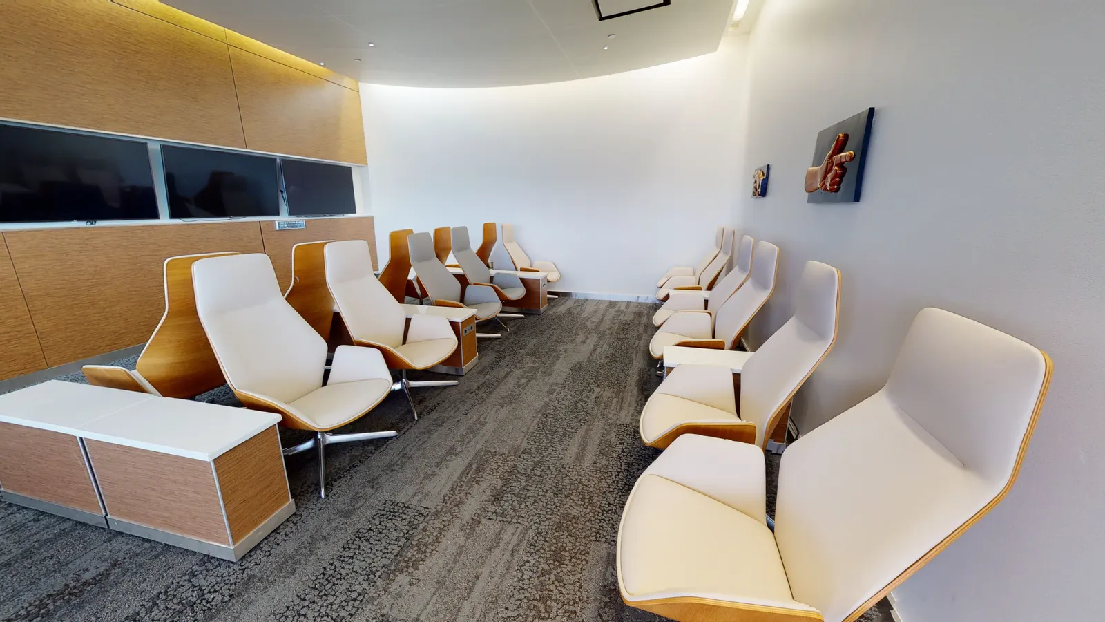 Lounge seating area in The Club at SEA South Satellite.